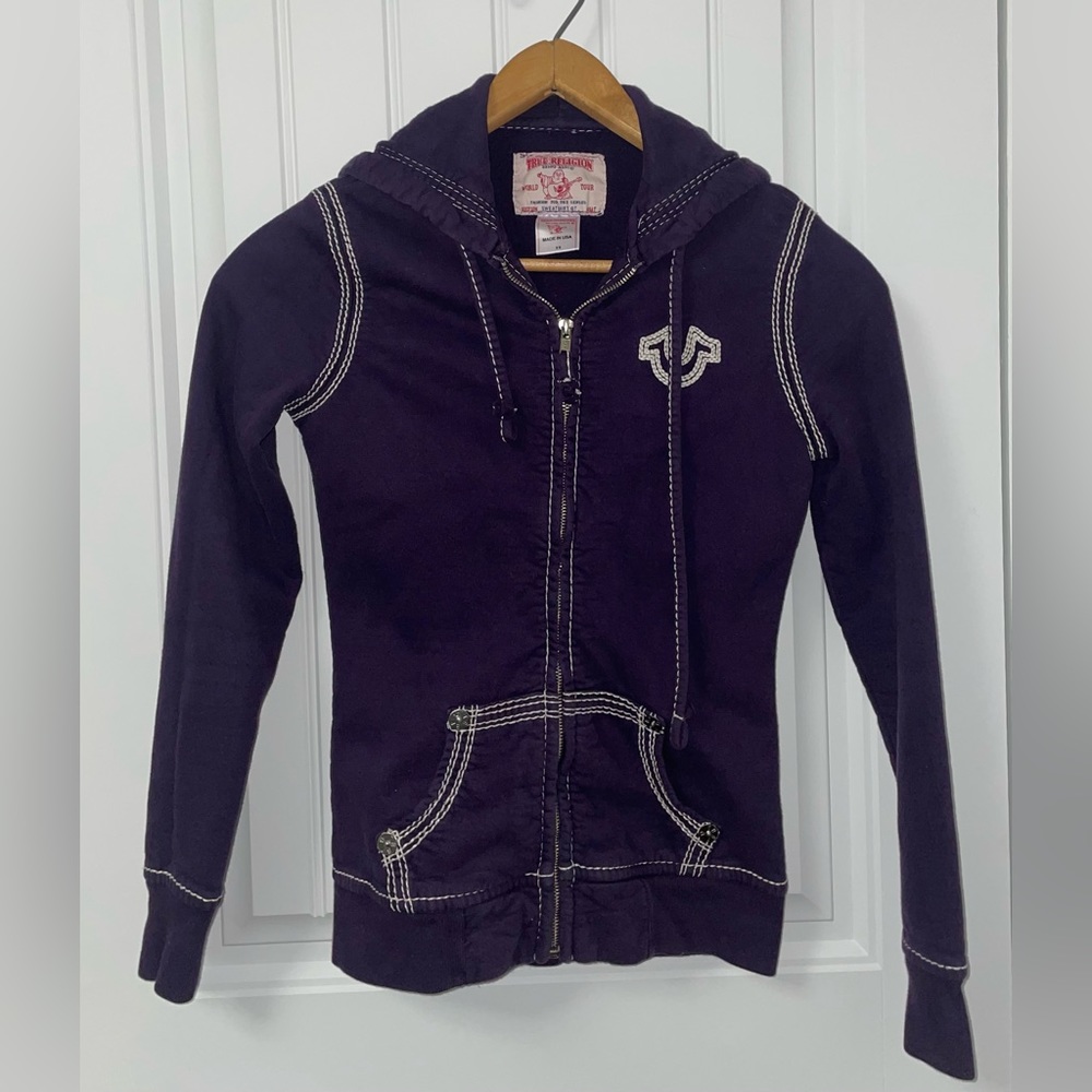 True Religion dark purple zip up hoodie with white stitching.
